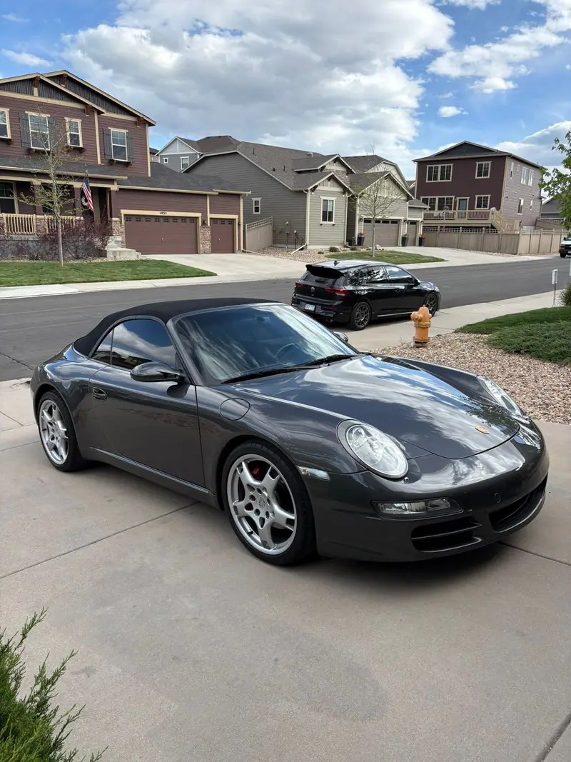 Gray Porsche 911 on a driveway after a ceramic coating